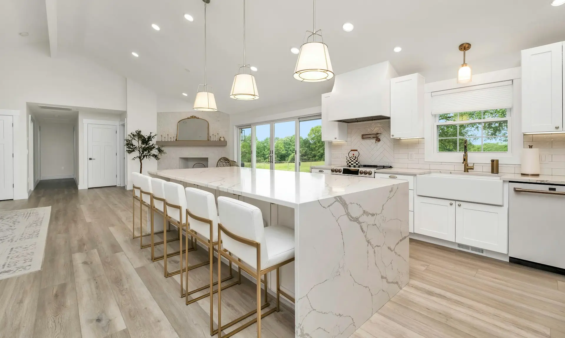 Modern kitchen with a marble island and white cabinets